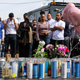 Fans of rapper Nipsey Hussle appear at a makeshift memorial in the parking lot of Hussle’s Marathon Clothing store in Los Angeles, Monday, Apr. 1, 2019.